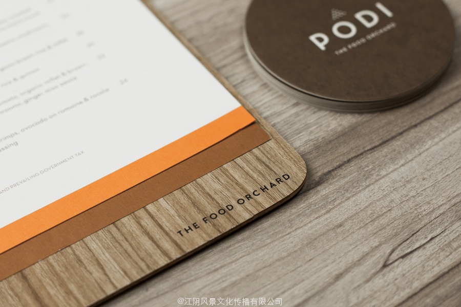 Logotype, menu with wood detail and coasters designed by Bravo Company for Singapore-based organic restaurant Podi
